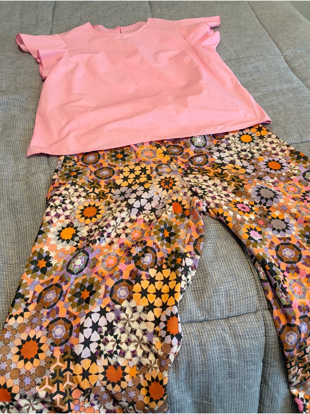 Pink Ruffle-Sleeve Top with Multicolor Geometric Mosaic Pants